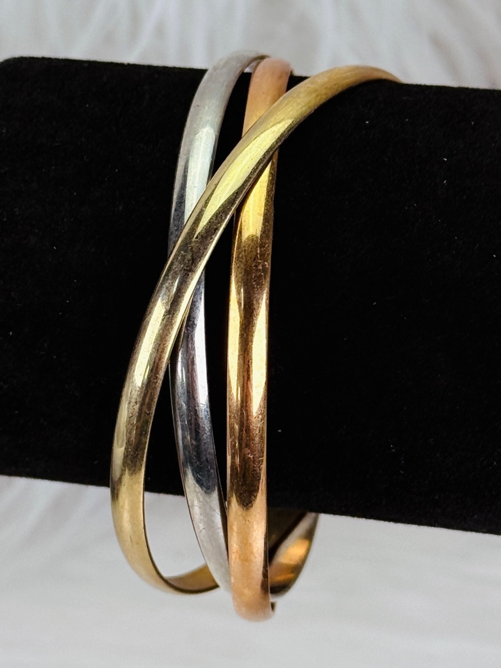 Vintage multimetal, goldtone and silvertone attached bangle trio